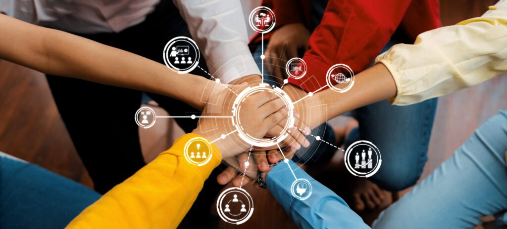Collaborative Teamwork Concept with Diverse Hands Uniting in a Circle on Wooden Floor, Symbolizing Cooperation, Unity, and Community Engagement. Amity